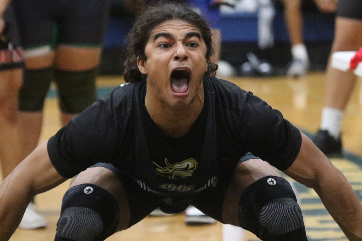Oakleaf High weightlifter Christian Rodriguez blasts some energy before winning his 169 pound weight division at the Clay County Championships held Friday at Keystone Heights.
