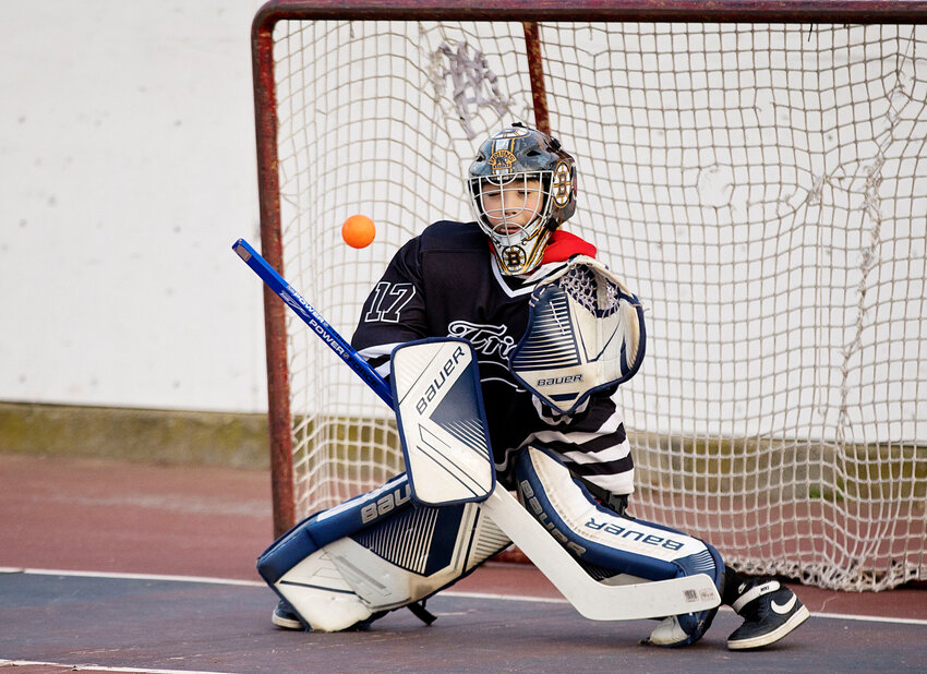 Goalie Weslee Mello makes a save during a recent preseason practice session prior to the inaugural season of Warren Youth Street Hockey at Jamiel Park.