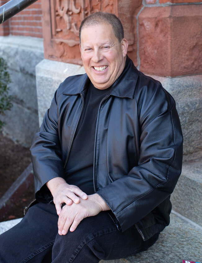 Scott Becker beams with pride after achieving his dream of self-publishing his first romance novel.