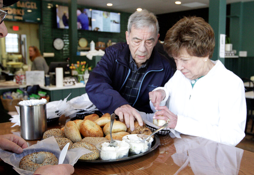 Joe and Julie Rego enjoy the bagels offered at a special reopening event for fellow local businesses at Bristol Bagel Works.