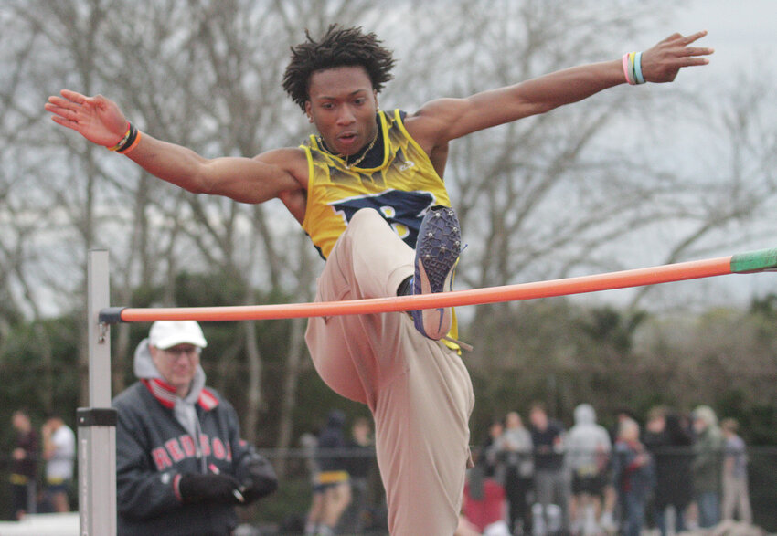 Barrington High School's Caleb Satisfield, shown hurdling the bar in the high jump during a meet at Portsmouth on Monday, April 21, finished first in the event at a meet on April 28.