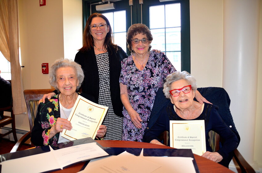 Franklin Court Assisted Living residents Dorothy Russo and Irma Letendre (seated l-r) were honored recently in recognition of their 100th and 102nd birthdays. Joining in the celebration (standing) were Franklin Court Assisted Living Administrator Angela Cabral (left) and Paula A. Bradley, Senior Field Representative from Sen. Sheldon Whitehouse's office.