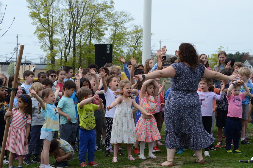 PCD music teacher, Piera Leone, leads elementary school students in the singing of “Let it Grow” from “The Lorax”.