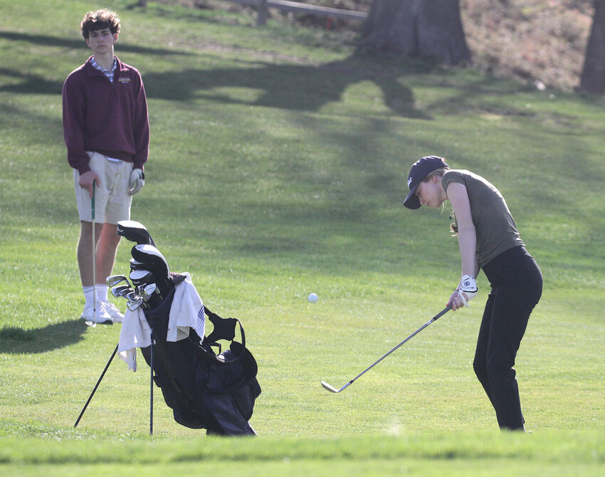 Barrington High School’s Claire McTaggart hits a shot during a recent round at Rhode Island Country Club. McTaggart led the Eagles with a 37 in their season-opener.