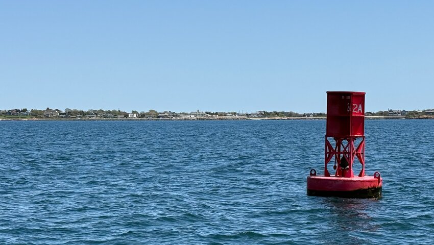 Fishermen call bell buoy 2a the “middle buoy.” It lies one mile west of Sakonnet Harbor, which lies in the background of this photo.