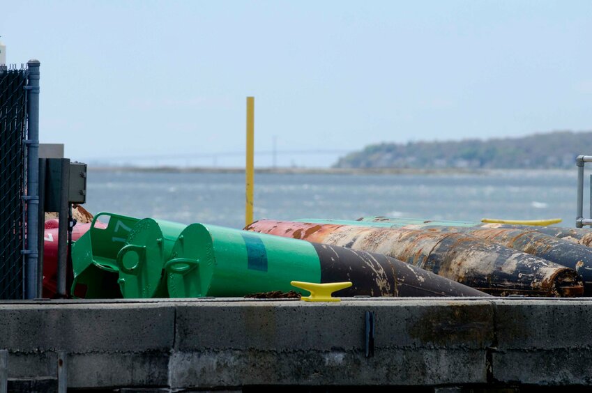 Navigational buoys sit waiting for maintenance at the U.S. Coast Guard’s Aids-to-Navigation Team station in Bristol.