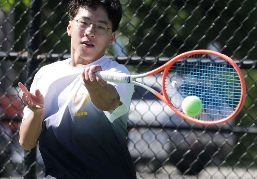Barrington’s number four singles player, Justin Kuo, hits a forehand during a recent match.