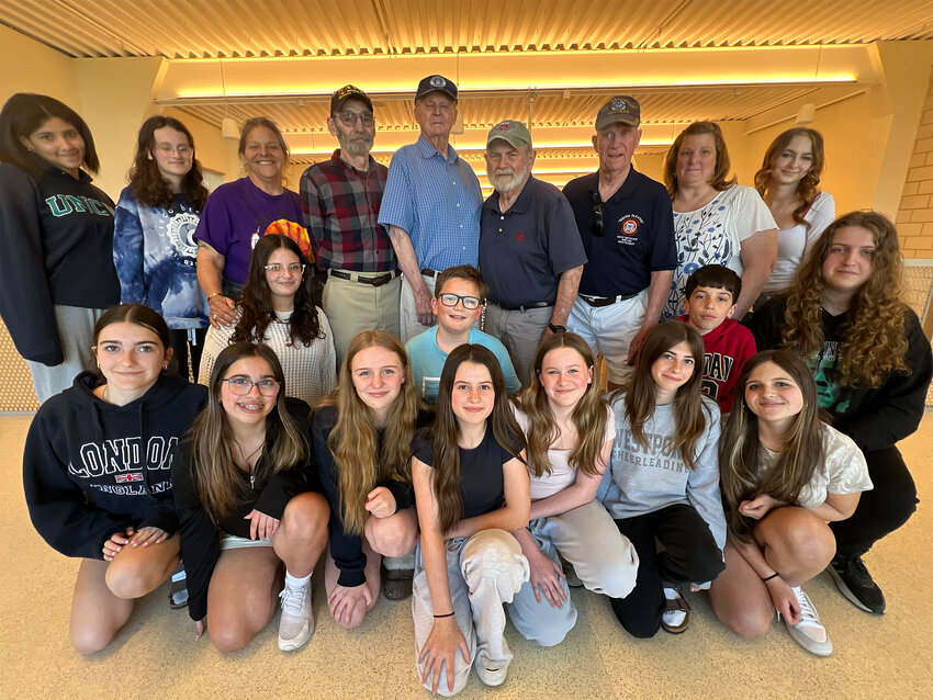 Westport middle school students, and several of the veterans they interviewed, at the school last week.