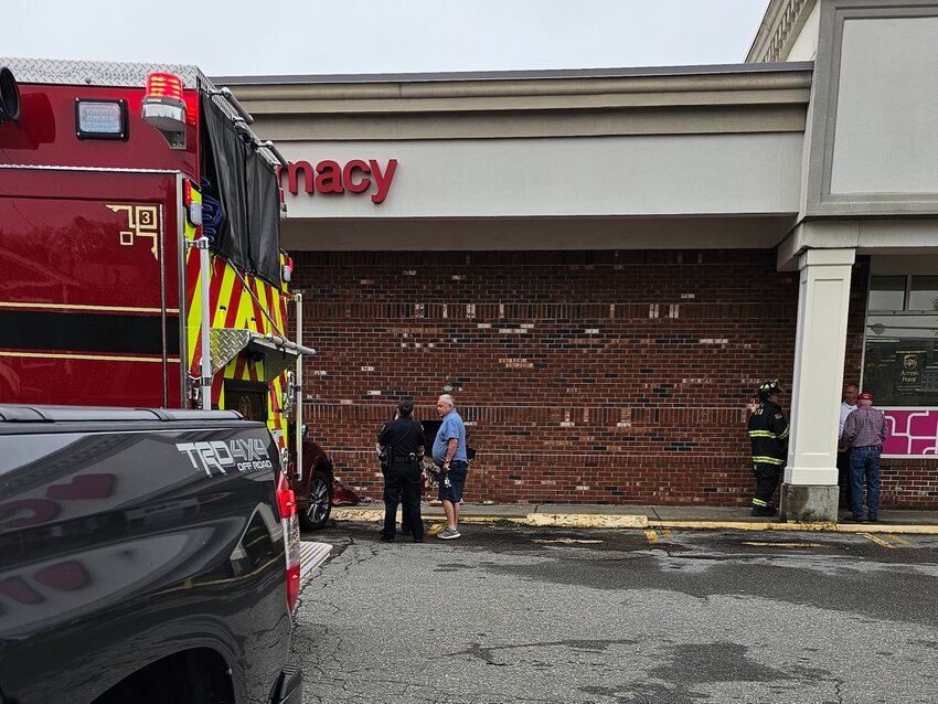 Scenes from the motor vehicle accident Thursday, May 15, that left a hole in the front facade of the CVS Pharmacy on Metacom Avenue.