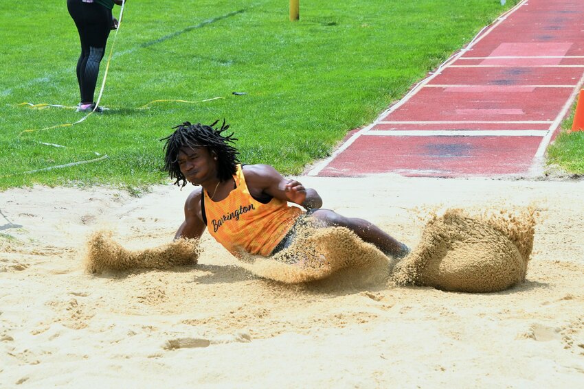 Barrington High School’s Charly Potter soars to a first place finish in the long jump at the Eastern Division Championship on Sunday, May 18.