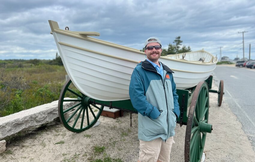 Cameron Baker, who helped build the boat at the International Yacht Restoration School in Newport, attended Sunday's unveiling.