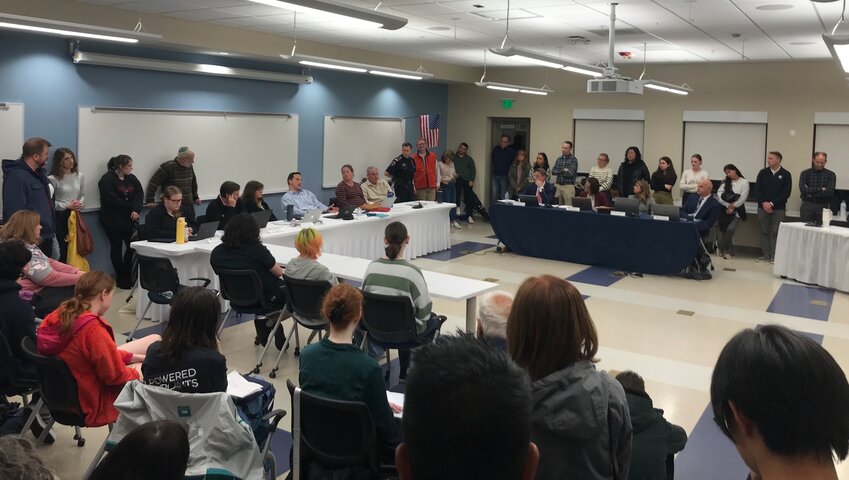Residents fill the Barrington Middle School presentation room during Thursday night’s school committee meeting. Many of the residents were there to speak about whether to keep religious holidays on the school calendar.