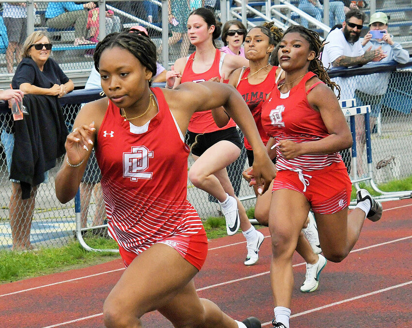 Nazarae Phillip sprints ahead of teammate Kendra Daniel to take gold in the 100-meter relay. The Townies swept the event as Gionna DosSantos placed second and Daniel placed third. 
Phillip, a senior, won gold in three events for the girls’ team. The speedster placed first in the 100-meter dash with a time of 12.62 seconds, the 200-meter dash with a time of 26.62 seconds and the high jump, clearing the bar at 5 feet, 3 inches.