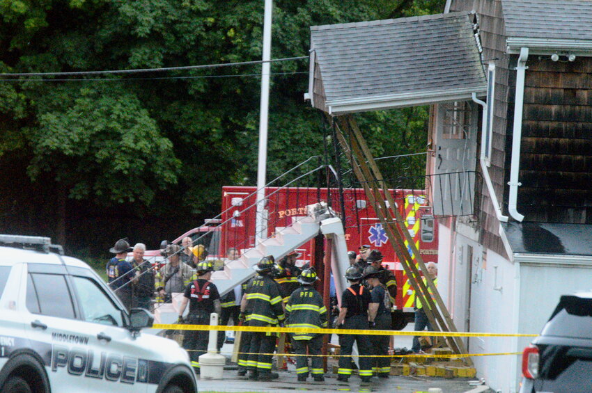 The stairway to the second floor of the Portsmouth Portuguese American Citizens Club after the landing had collapsed Saturday night, killing a 15-year-old girl and injuring several others.