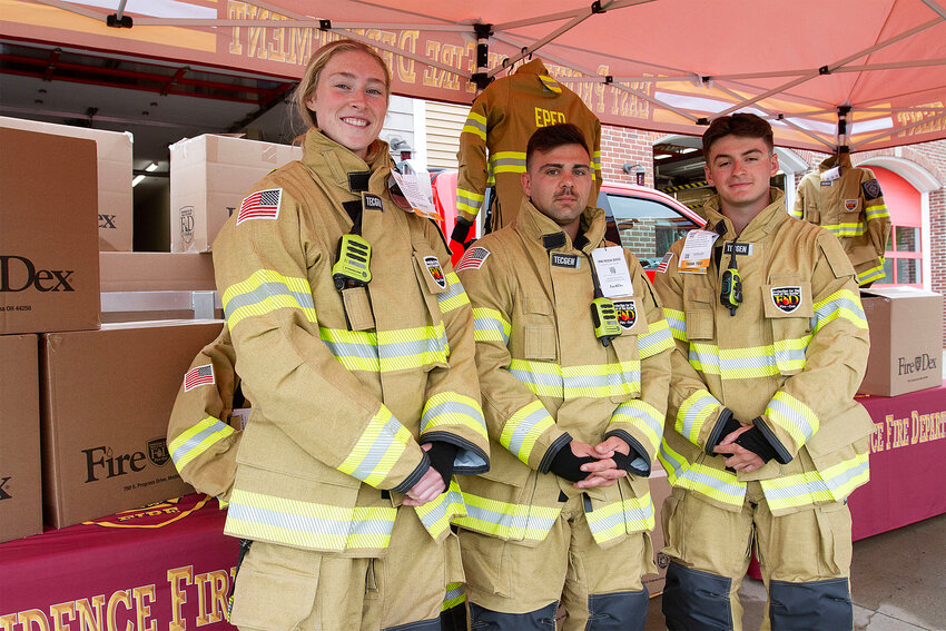 East Providence firefighters  Danielle Clarke, Matthew Ricci and Domenic Amitrano pose in their new turnout gear.