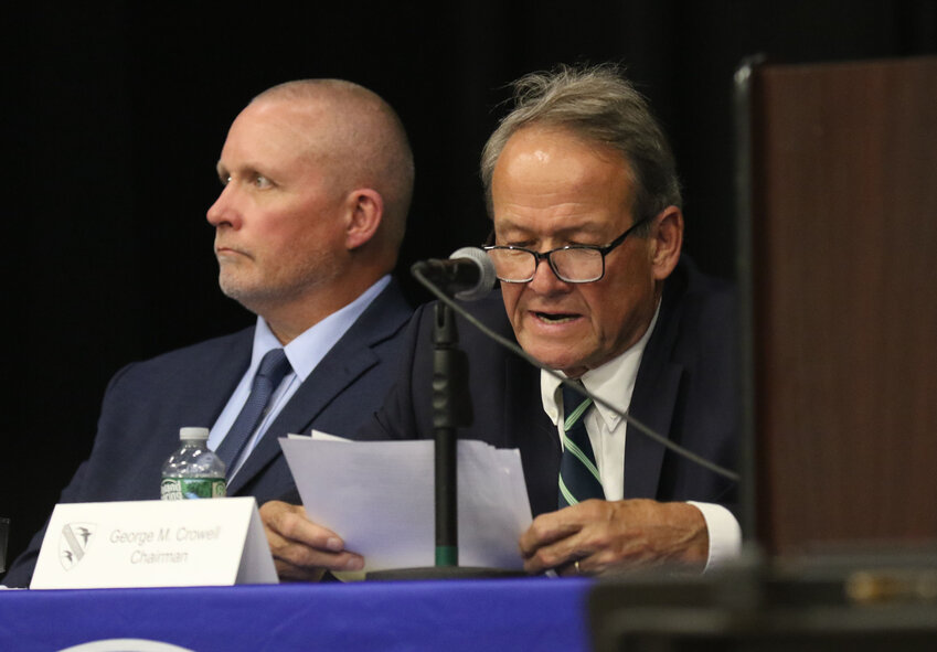 Long-term budget committee chairman George Crowell (right), shown here at Tuesday's financial town meeting, tied with challenger Scott W. Lewis for the third and final open seat on committee, at Tuesday's town elections.