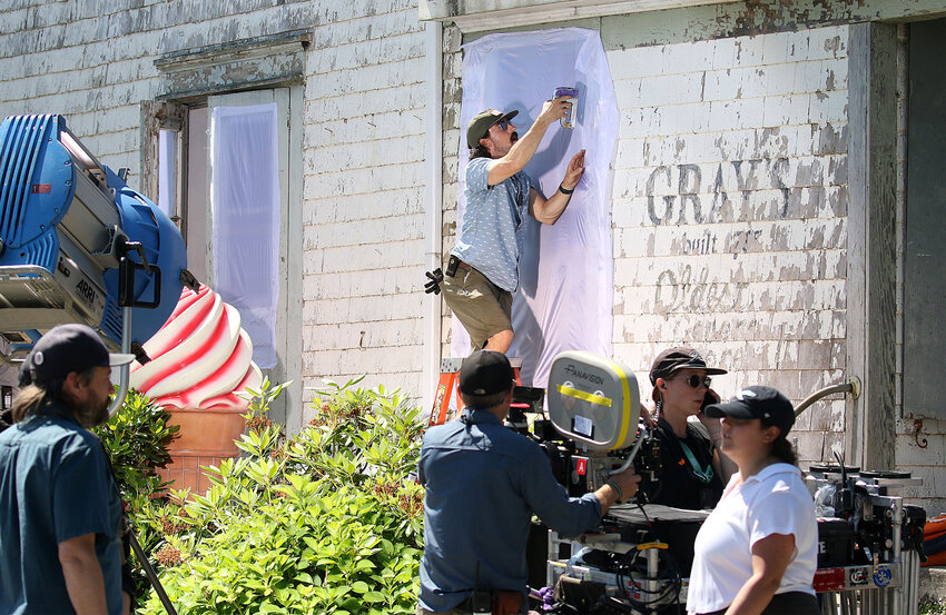 Set crews ready the former Grays General Store for filming Friday.