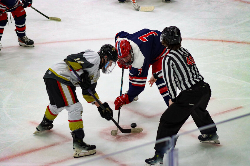 Connor Rogers takes the defensive zone face-off for Portsmouth.