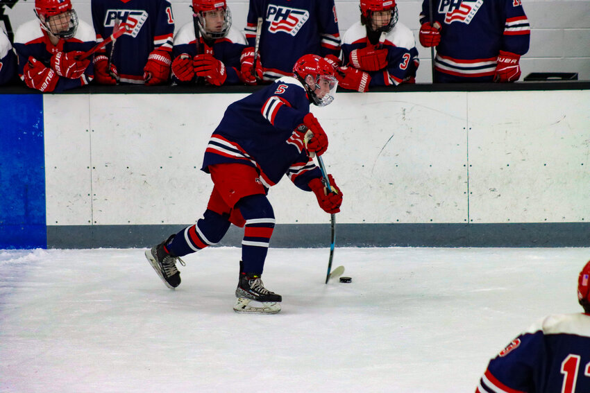 From the point, Finn O’Conner lets a powerful wrist shot go towards the net