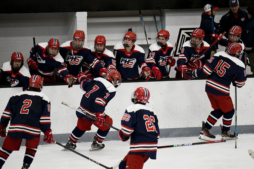 The Patriots celebrate after tying the score, 3-3, in the third period.