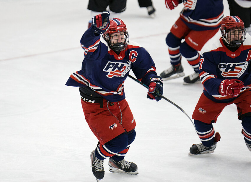 Shane Temple celebrates after giving the Patriots an early 1-0 lead in the first period.