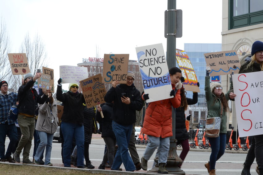 Hundreds of protesters chant and march through downtown Providence on Friday, March 7 as part of a nationwide series of demonstrations called “Stand Up For Science”.