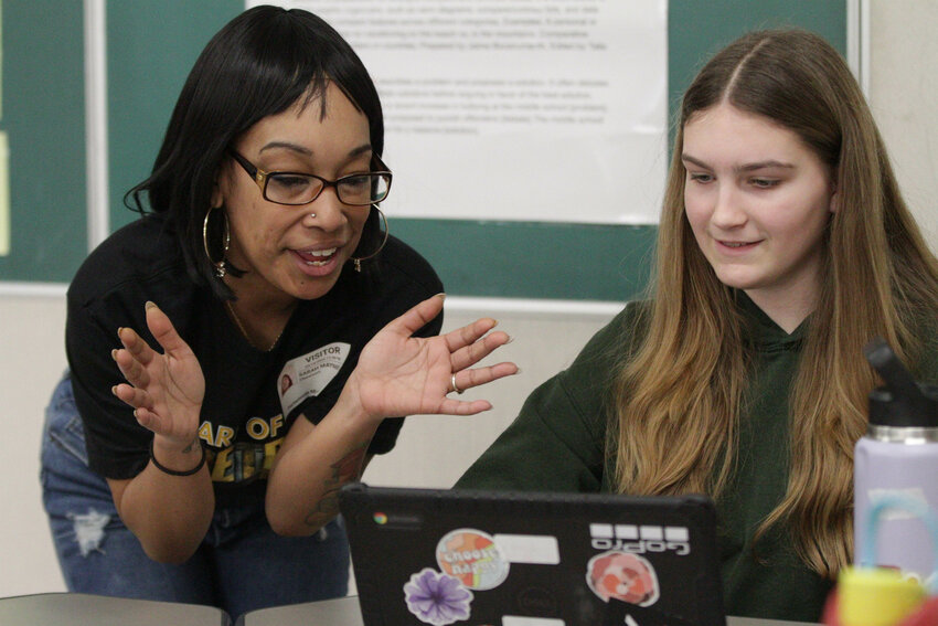 Author Sarah Ashley chats with Charlotte Reed about an essay she had written for an exercise during Portsmouth Middle School’s fourth All Day Audible with Authors events last Friday.
