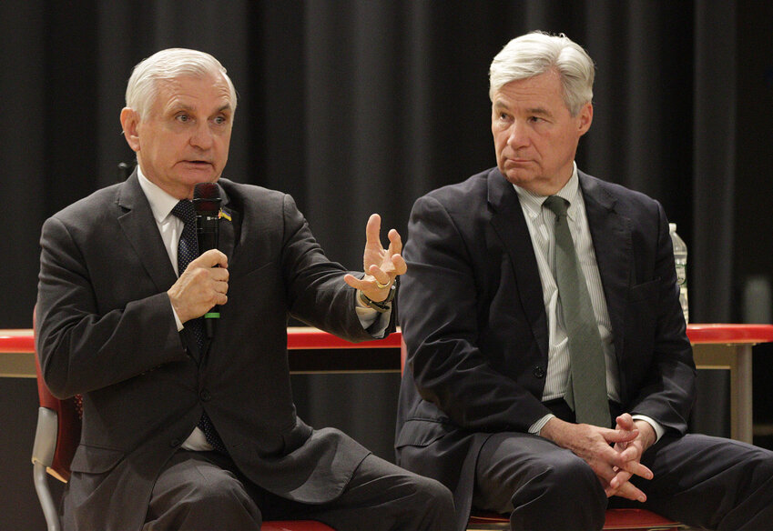 Sen. Jack Reed answers a question while Sen. Sheldon Whitehouse listens.