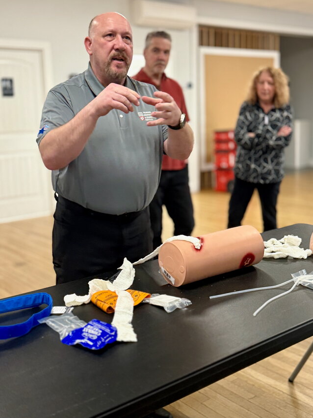 Robert Holland of the R.I. Medical Reserve Corps’ Training, Innovation & Leadership Group leads a presentation on how to pack a patient’s wound with gauze until first-responders arrive.