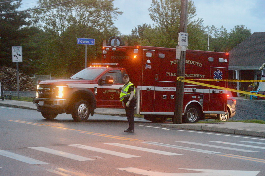 A Portsmouth Fire Department rescue truck leaves the scene from Power Street. Police would not allow access to the street to anyone but rescue workers during the operation.