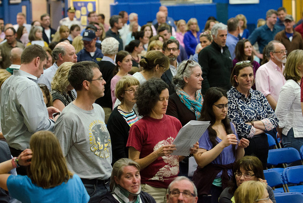Taxpayers stand for a vote at the 2017 Barrington Financial Town Meeting.