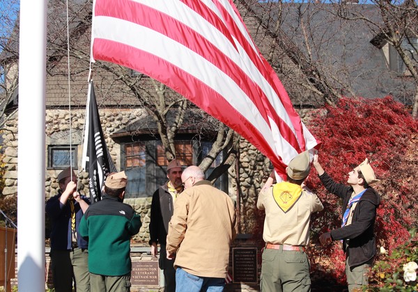 Members of Barrington Boy Scout Troop 2 raise the flag during the Veterans Day ceremony outside Barrington Town Hall in Nov. 2018. This year's event will be held at Victory Gates at Barrington High School.