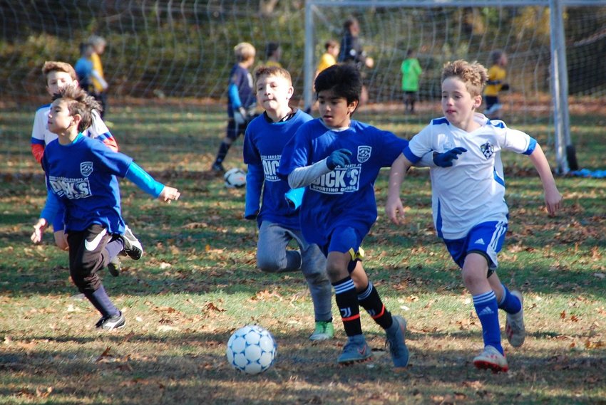 Teams compete in a previous year's soccer tournament in Barrington.