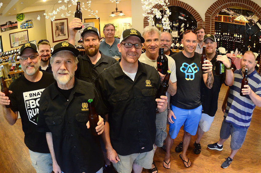 Members of the East Bay Homebrew Club &mdash; winners of the 2019 Boil Rumble national homebrew contest &mdash; raise their beers earlier this year. Club members have been invited to a special release party on Dec. 6 at Malted Barley in Providence.