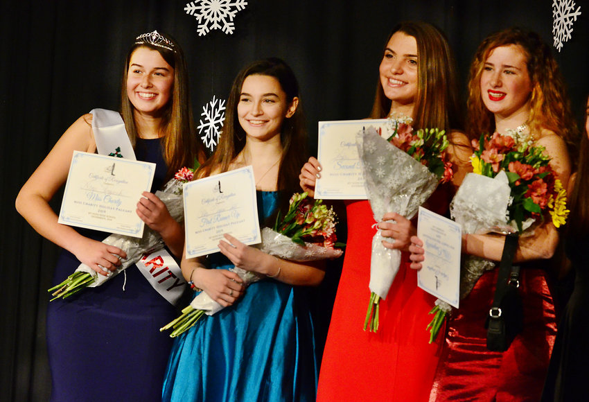 Miss Charity 2019 Winner Annie Krzywicki (left), runner-ups Colby Dagwan-Santos, Hope Tyska and Miss Congeniality Molly Thibaudeau pose for a photo on the Mt. Hope High School auditorium stage after the pageant.