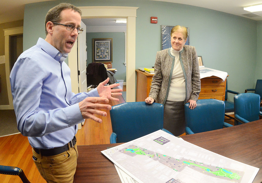 Town Planner Ed Tanner (left) and Director of Community Development Diane Williamson look at plans for an improved Bristol Golf Club &mdash; envisioned as a nine-hole, par-3 course with new design, holes, water management, bridges, walkways and more.