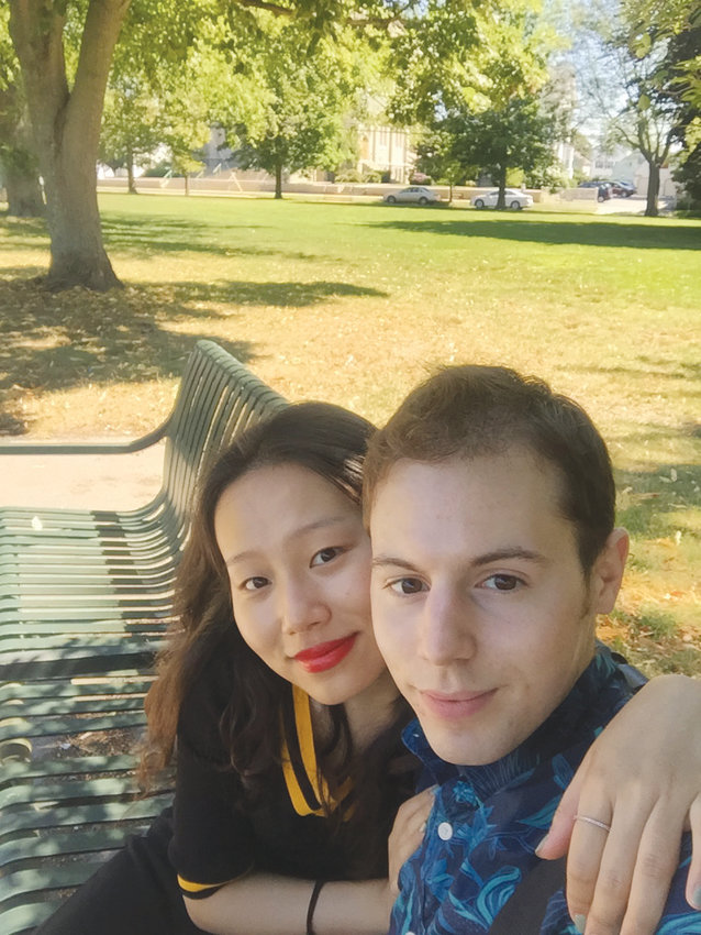 Kevin Spencer with his wife, Tian. He is finishing his master&rsquo;s degree in China, while she is studying in the UK. The couple will return to the United States this fall.