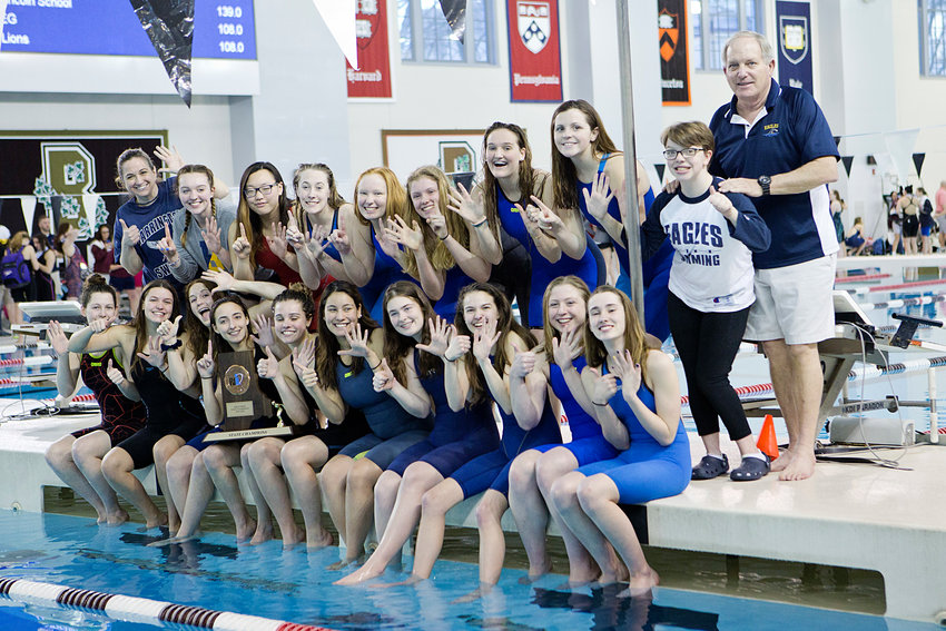 The Barrington High School girls swim team poses for a photo after becoming state champions for the sixth consecutive year, on Saturday.