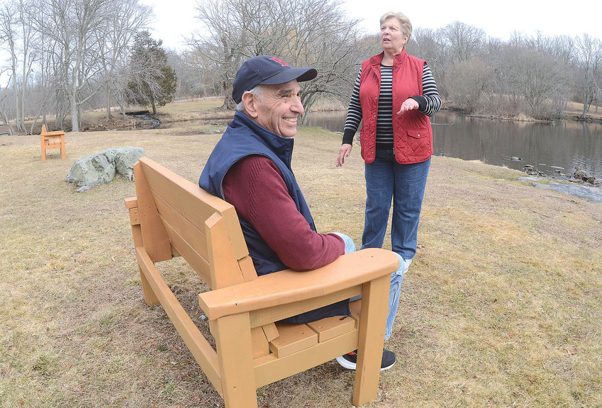 Al and Val Carreiro enjoy one of the new benches Al has built for Mount Hope Farm walkers to enjoy. He was motivated to provide a resting spot for walkers like himself and his wife of six decades.