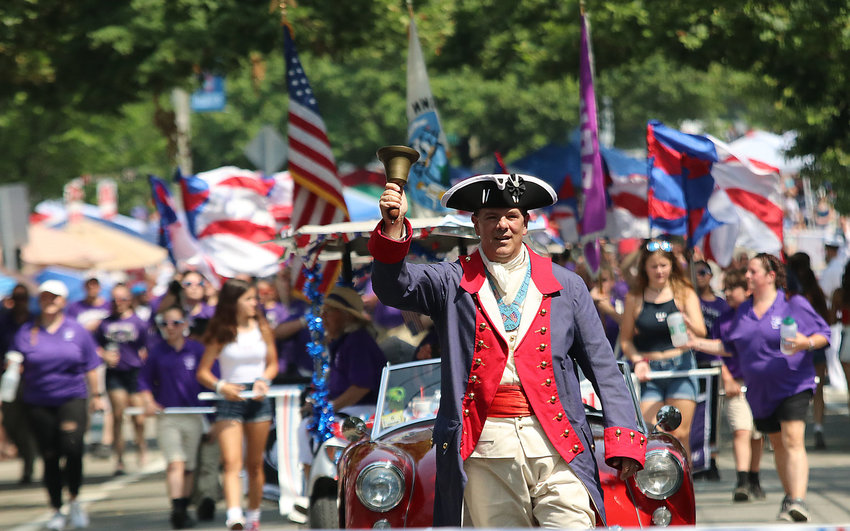 The Town Crier leads the 2019 Bristol Fourth of July Parade.
