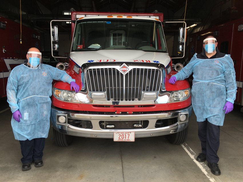 Bristol Fire Marshal Robert Ferguson (left) and Fire Chief Michael DeMello demonstrate the full package of protective gear they use if responding to a call with a known or suspected Covid-19 patient.