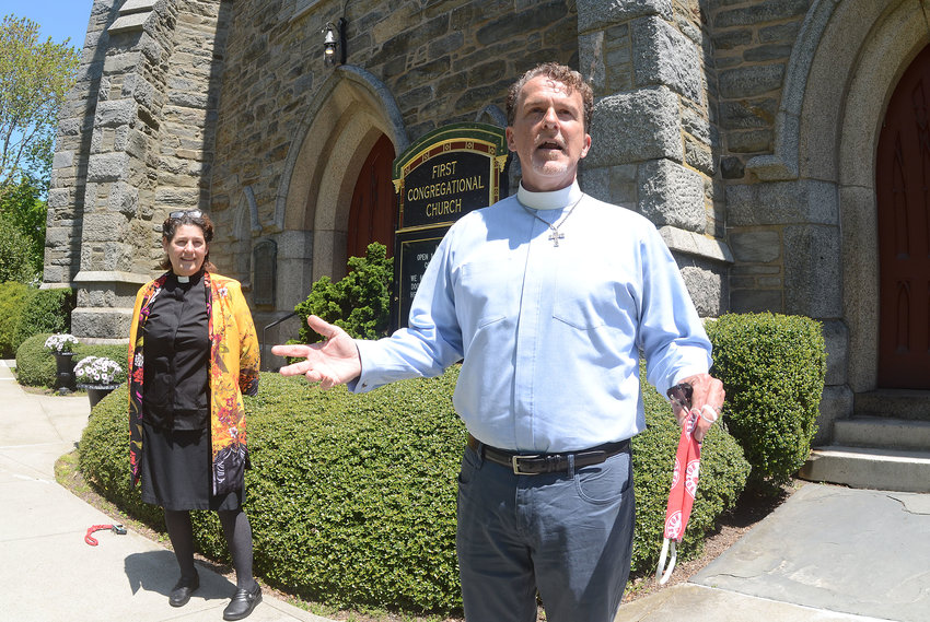 Pastor Burton Bagby-Grose (foreground) with pastor for youth and missions Hilary McLellan will be keeping the doors of the First Congregational Church closed to in-person worship, for now.