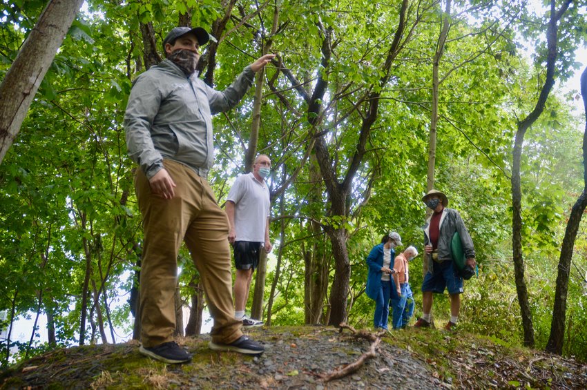 Nathan Minese leads a tour of the earthworks surrounding Butts Hill Fort in 2020. Public Archeology Laboratory just released an archeologic assessment of the property, which makes several recommendations related to future restoration work there.
