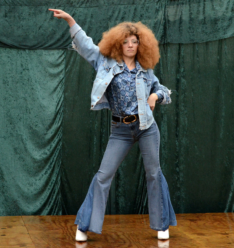 Sara Slusarski rehearses a Travolta-esque dance to the Bee Gees&rsquo; &ldquo;Night Fever,&rdquo; on a backyard stage for their upcoming production of &ldquo;Grease: 1979.&rdquo;