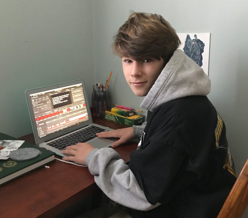 Aidan Weber, working on his computer at home, made a video, founded a website and spread the word around school about his fund-raiser for the Wounded Warrior Project. To date, the drive has raised more than $1,100 for the organization.