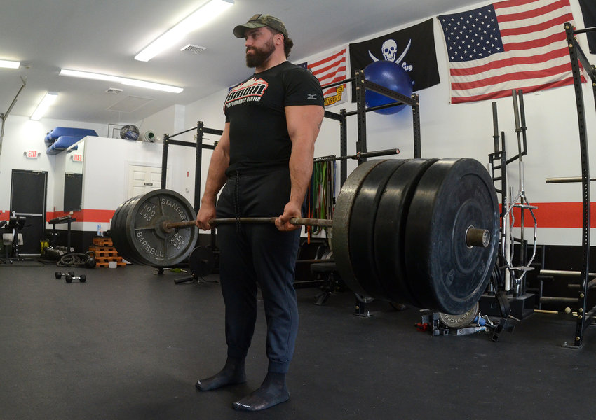 Rob Ruggiero finishes a deadlift of more than 500 pounds inside his Bristol gym. In a recent competition he deadlifted 670 pounds.