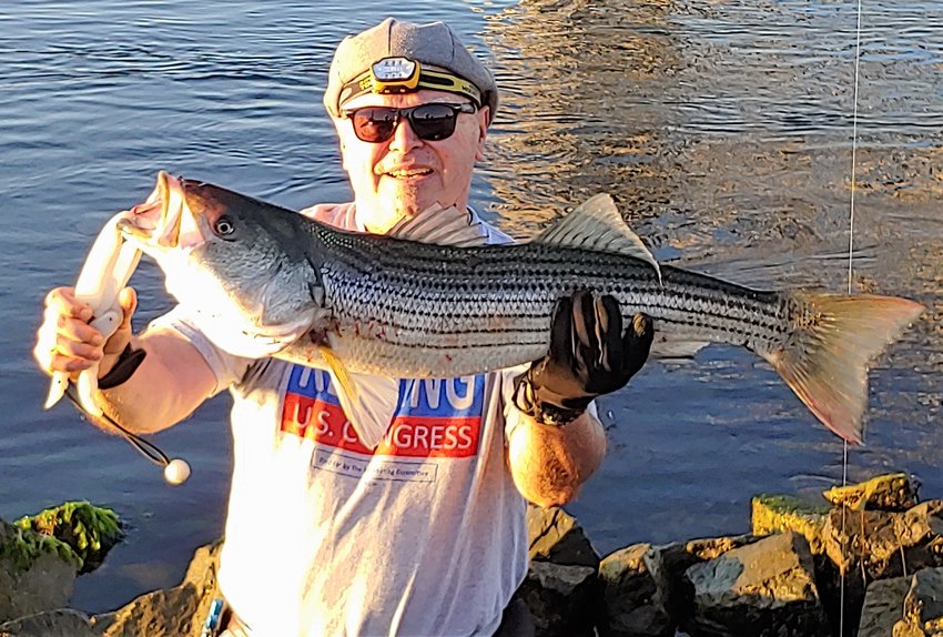 Canal fishing: East End Eddy Doherty with striped bass from the Cape Cod Canal.