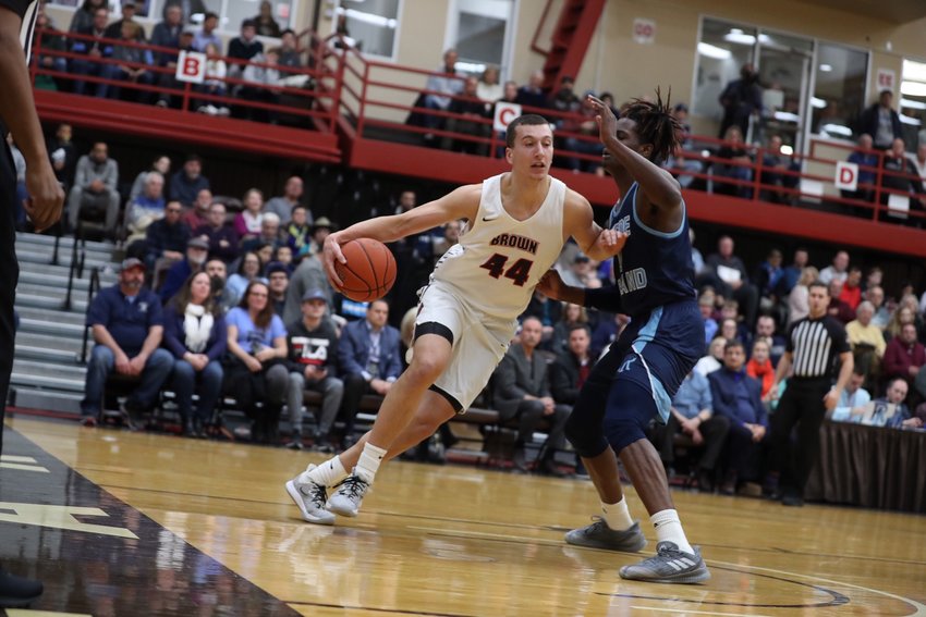 Brown University's Matt DeWolf drives to the basket during a game against URI. Matt starred at Barrington High School and later at Northfield Mount Hermon before heading to Brown University.
