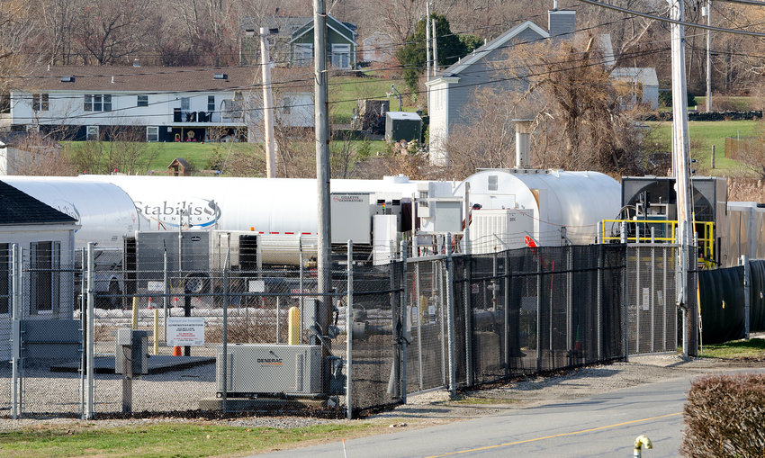 Rhode Island Energy (formerly National Grid) wants to push its temporary LNG facility further back from Old Mill Lane in hopes of mitigating noise and lighting issues. (File photo)
