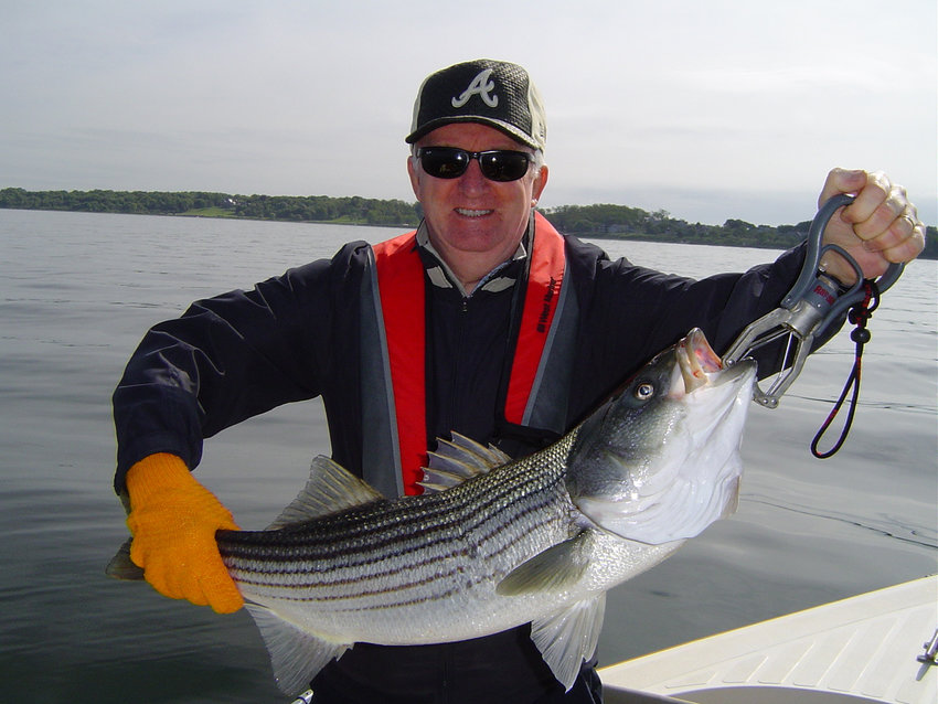 Poppasquash Point, Bristol striped bass:&nbsp; Ed Langon, a former Warwick resident now living in California, caught this striped bass using a tube and worm rig.&nbsp; Circle hooks are now required to be used on the rig.